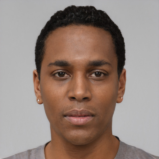 Neutral black young-adult male with short  black hair and brown eyes