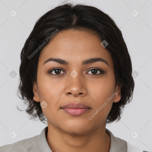 Joyful latino young-adult female with medium  brown hair and brown eyes