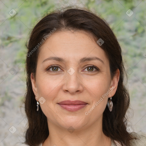 Joyful white adult female with medium  brown hair and grey eyes