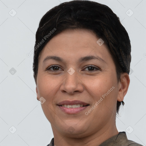 Joyful white adult female with short  brown hair and brown eyes