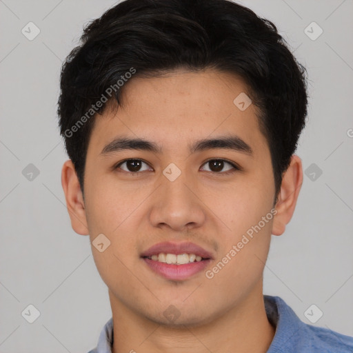 Joyful asian young-adult male with short  brown hair and brown eyes