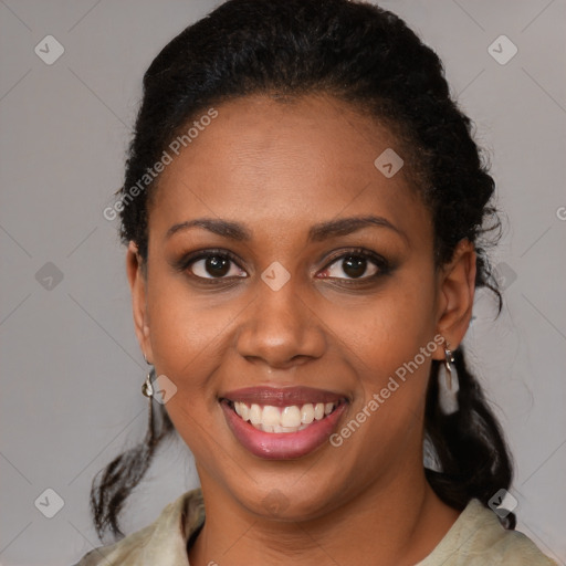 Joyful black young-adult female with medium  brown hair and brown eyes