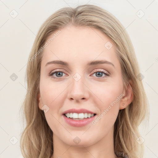 Joyful white young-adult female with medium  brown hair and blue eyes