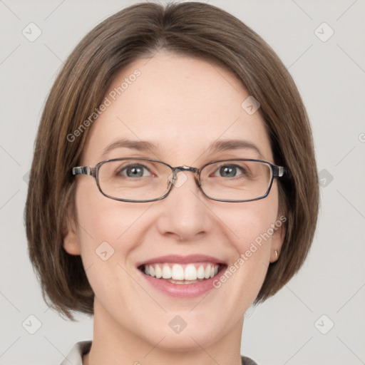 Joyful white adult female with medium  brown hair and grey eyes