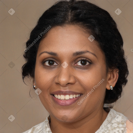 Joyful black young-adult female with medium  brown hair and brown eyes