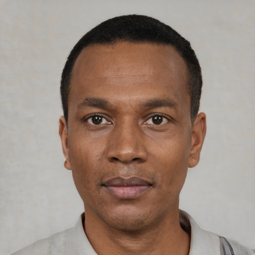 Neutral black young-adult male with short  black hair and brown eyes