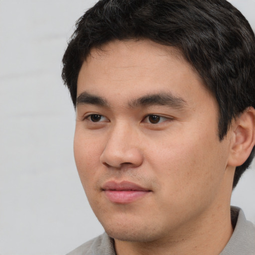 Neutral asian young-adult male with short  black hair and brown eyes