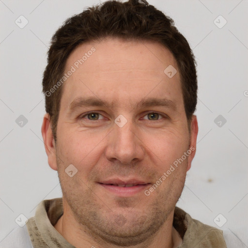 Joyful white adult male with short  brown hair and grey eyes