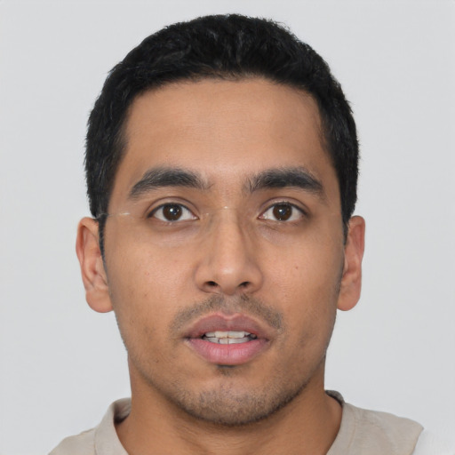 Neutral latino young-adult male with short  black hair and brown eyes