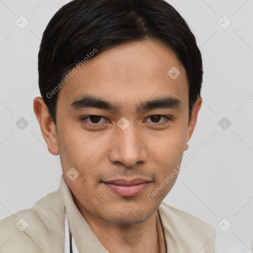 Joyful latino young-adult male with short  brown hair and brown eyes