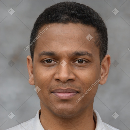 Joyful latino young-adult male with short  brown hair and brown eyes