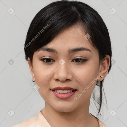 Joyful asian young-adult female with medium  black hair and brown eyes