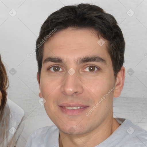 Joyful white young-adult male with short  brown hair and brown eyes