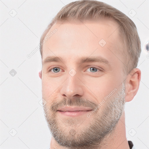 Joyful white adult male with short  brown hair and grey eyes