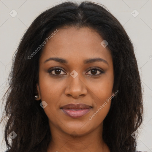 Joyful black young-adult female with long  brown hair and brown eyes