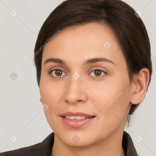 Joyful white young-adult female with short  brown hair and brown eyes