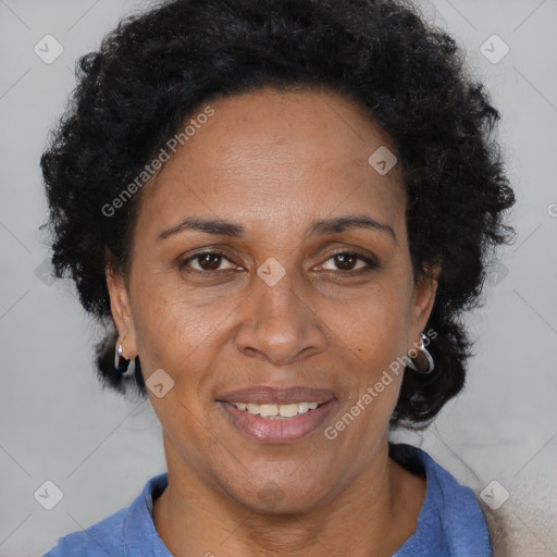 Joyful black adult female with short  brown hair and brown eyes