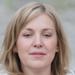 Joyful white young-adult female with medium  brown hair and blue eyes