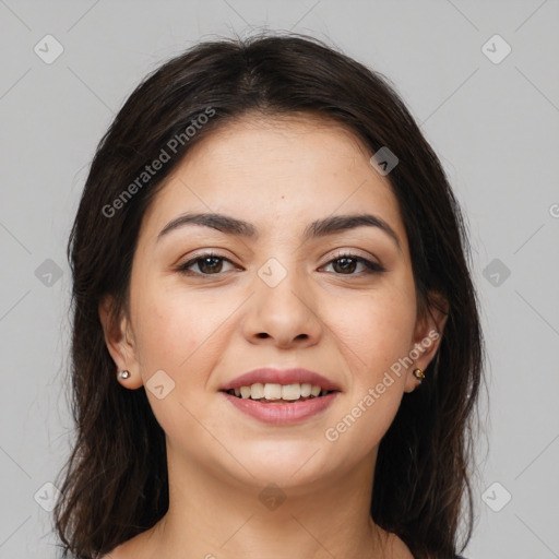 Joyful white young-adult female with long  brown hair and brown eyes