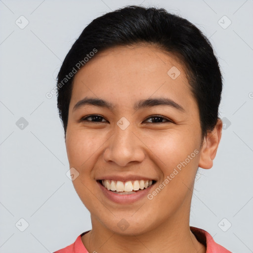 Joyful asian young-adult female with short  black hair and brown eyes