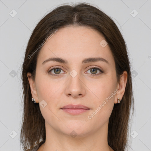 Joyful white young-adult female with long  brown hair and grey eyes