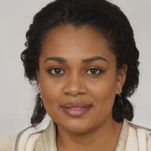 Joyful black young-adult female with medium  black hair and brown eyes