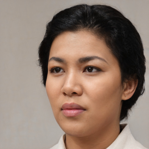 Neutral asian young-adult female with short  black hair and brown eyes