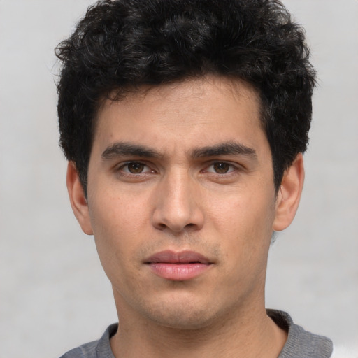 Neutral white young-adult male with short  black hair and brown eyes