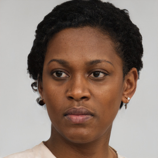 Neutral black young-adult female with short  black hair and brown eyes