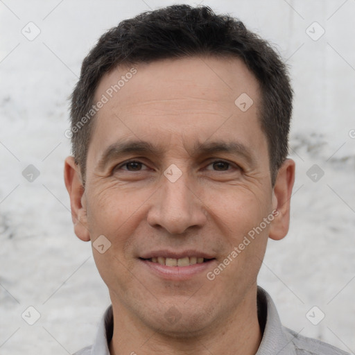 Joyful white adult male with short  brown hair and brown eyes