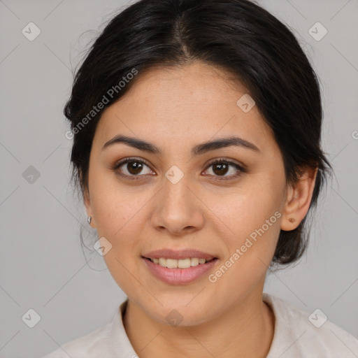 Joyful latino young-adult female with medium  brown hair and brown eyes