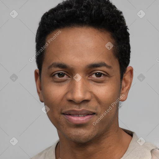 Joyful black young-adult male with short  black hair and brown eyes