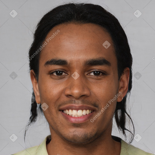 Joyful black young-adult male with short  black hair and brown eyes