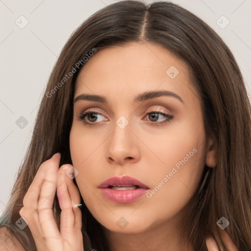 Neutral white young-adult female with long  brown hair and brown eyes