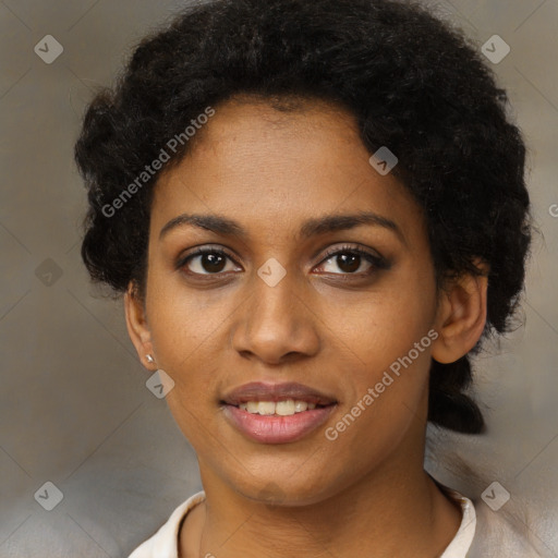 Joyful black young-adult female with short  black hair and brown eyes