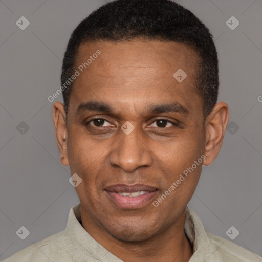 Joyful latino adult male with short  black hair and brown eyes