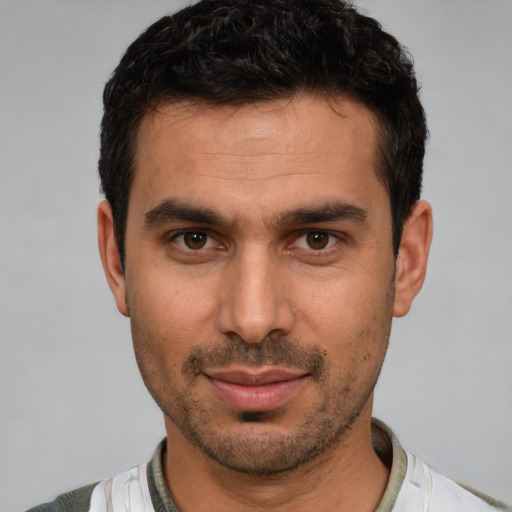 Neutral white young-adult male with short  black hair and brown eyes