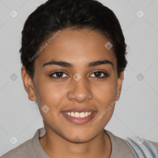 Joyful latino young-adult female with short  black hair and brown eyes