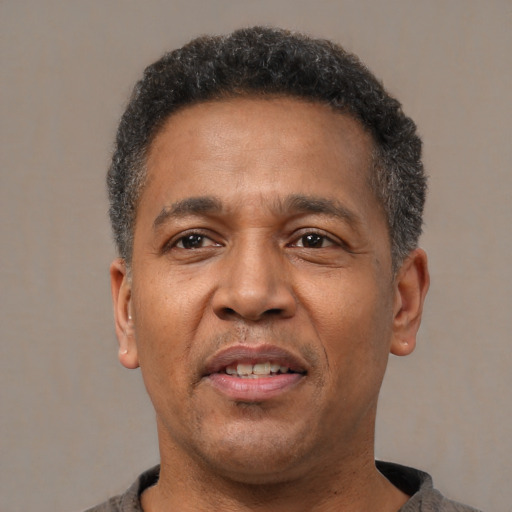Neutral latino adult male with short  black hair and brown eyes