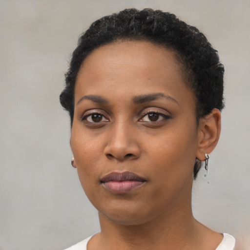 Neutral black young-adult female with short  black hair and brown eyes