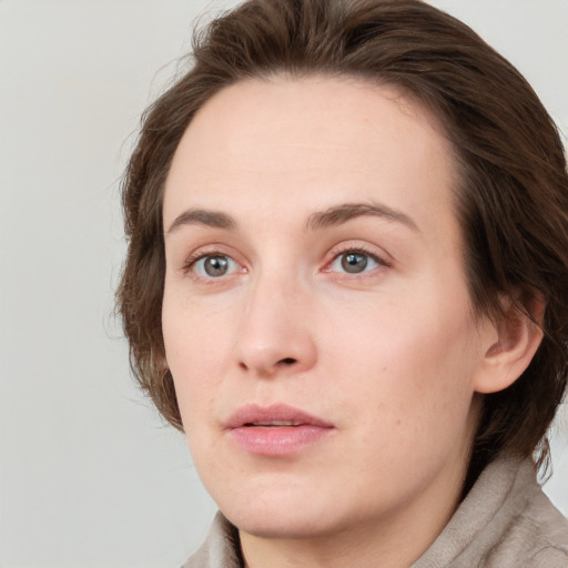 Neutral white young-adult female with medium  brown hair and grey eyes