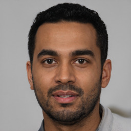 Neutral latino young-adult male with short  black hair and brown eyes