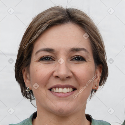 Joyful white adult female with medium  brown hair and grey eyes