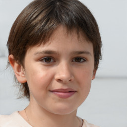 Joyful white child female with short  brown hair and brown eyes