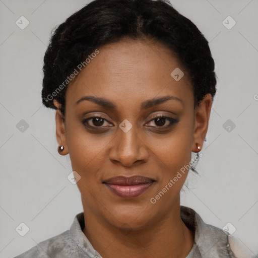 Joyful black young-adult female with short  black hair and brown eyes