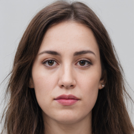 Joyful white young-adult female with long  brown hair and grey eyes