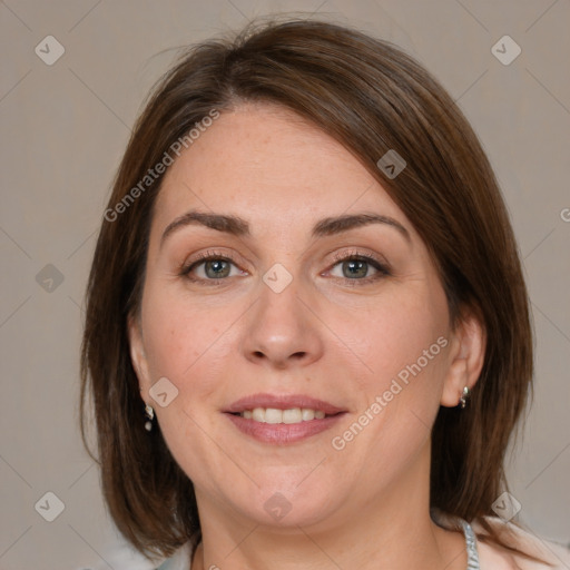 Joyful white adult female with medium  brown hair and blue eyes