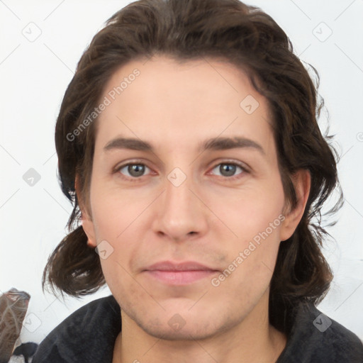 Joyful white young-adult male with medium  brown hair and brown eyes