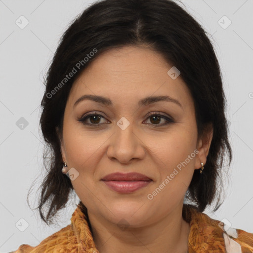 Joyful latino adult female with medium  brown hair and brown eyes