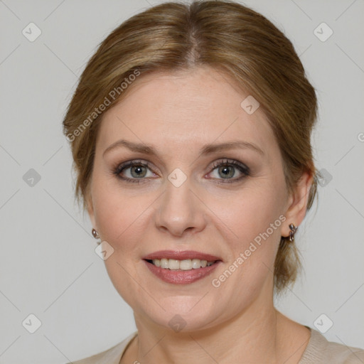 Joyful white adult female with medium  brown hair and blue eyes